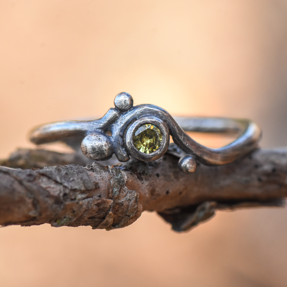 A closeup of sterling silver and pearl earrings