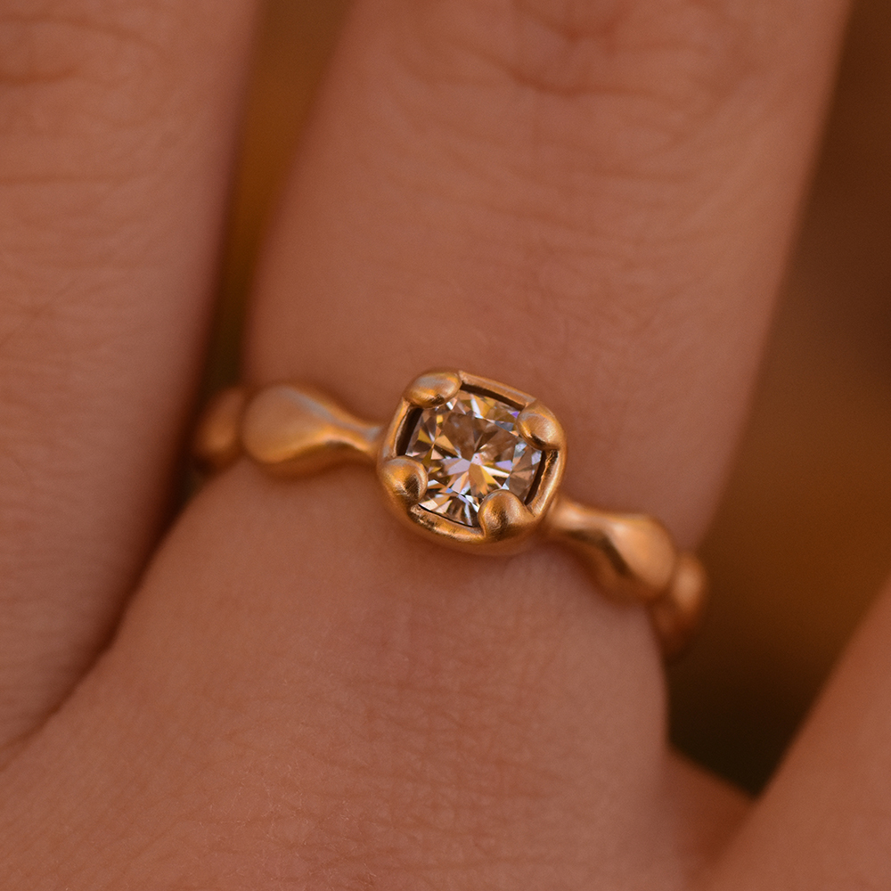 A photo of a 14k gold diamond ring
